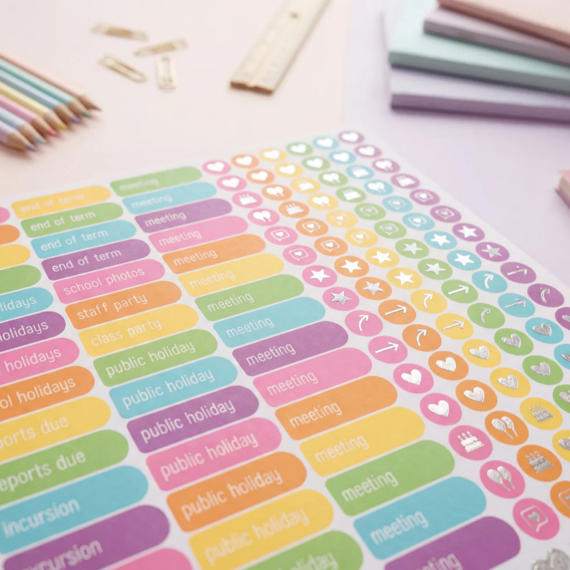 2027 Sacred Grandparent Tree Weekly Teacher Planner sticker sheet with colourful school labels and icons on a pastel desk.