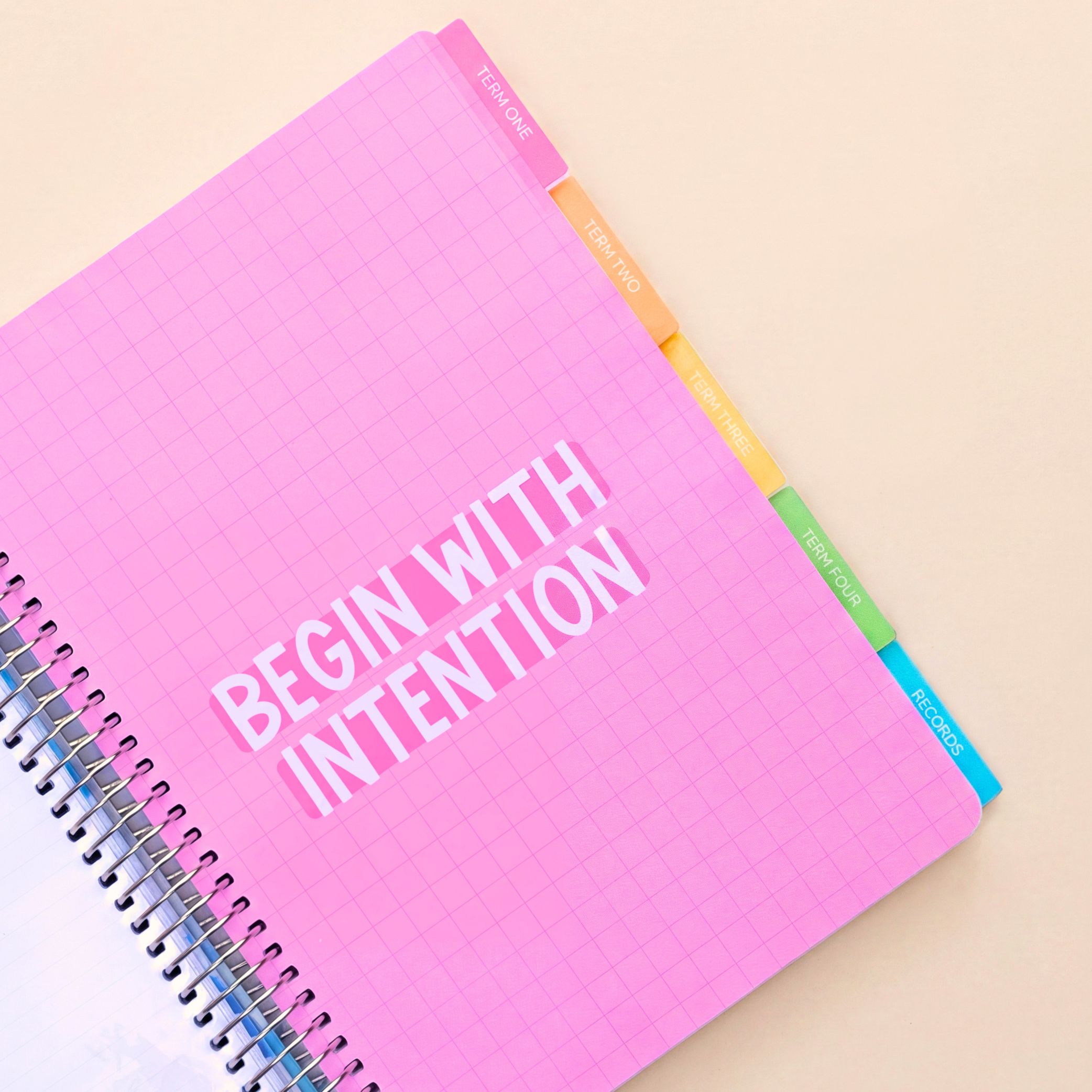 Inner page of 2027 Signature Planner with 'Begin With Intention' and coloured tabs for Term One, Two, Three, Four and Records.