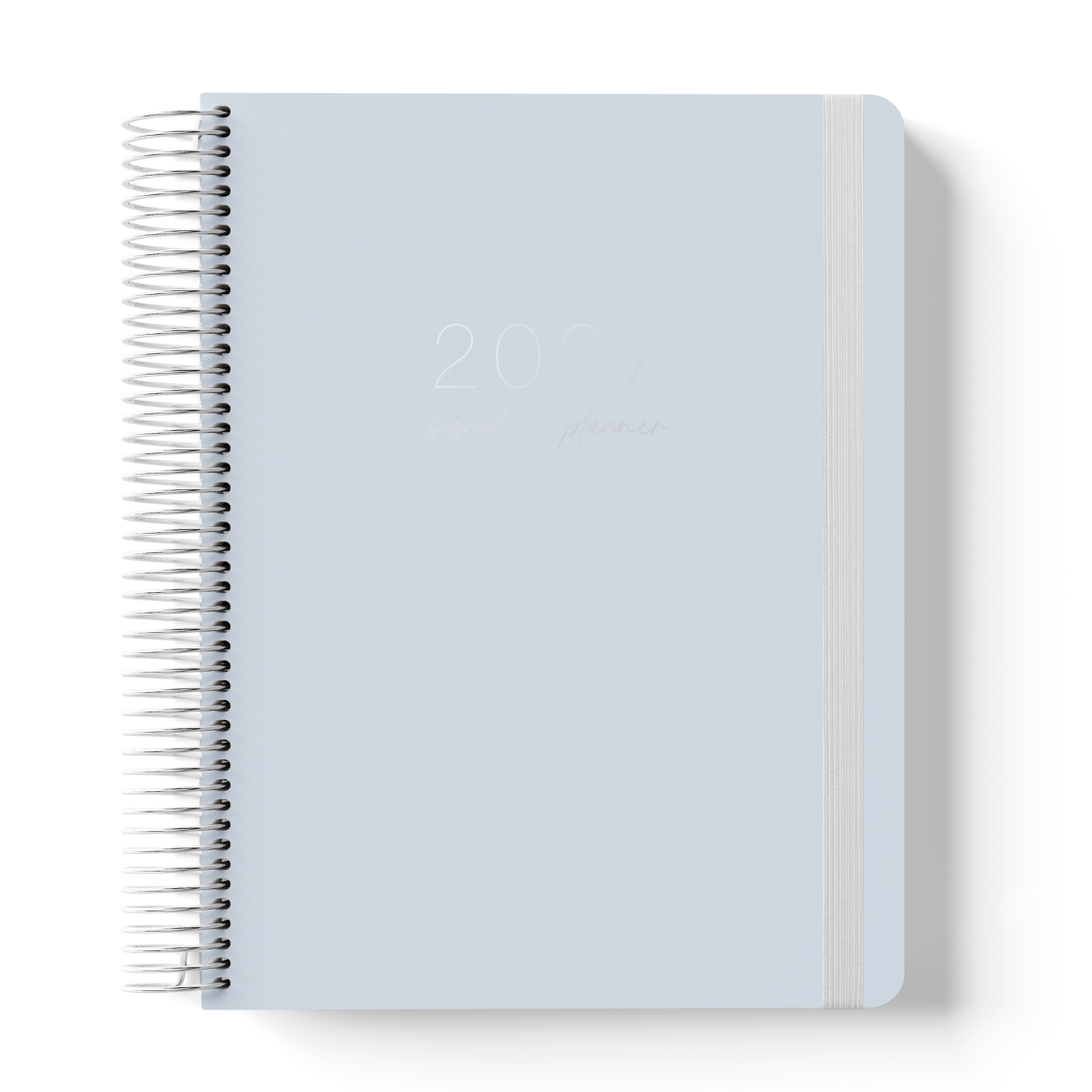 2027 Signature Planner in Dusk with tonal text on a soft blue-grey cover, silver coil binding, and matching grey elastic closure.