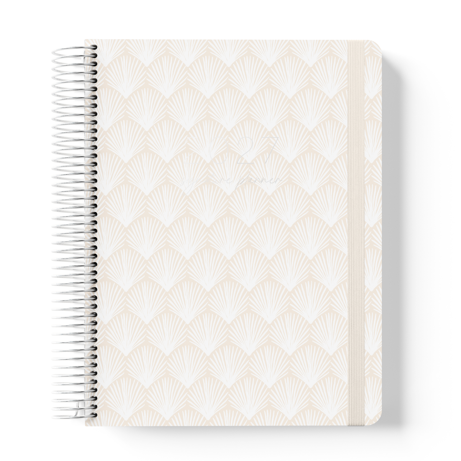 2027 Signature Planner in Shells with a repeating fan shell pattern in soft white and sand, silver coil binding, and cream elastic closure.