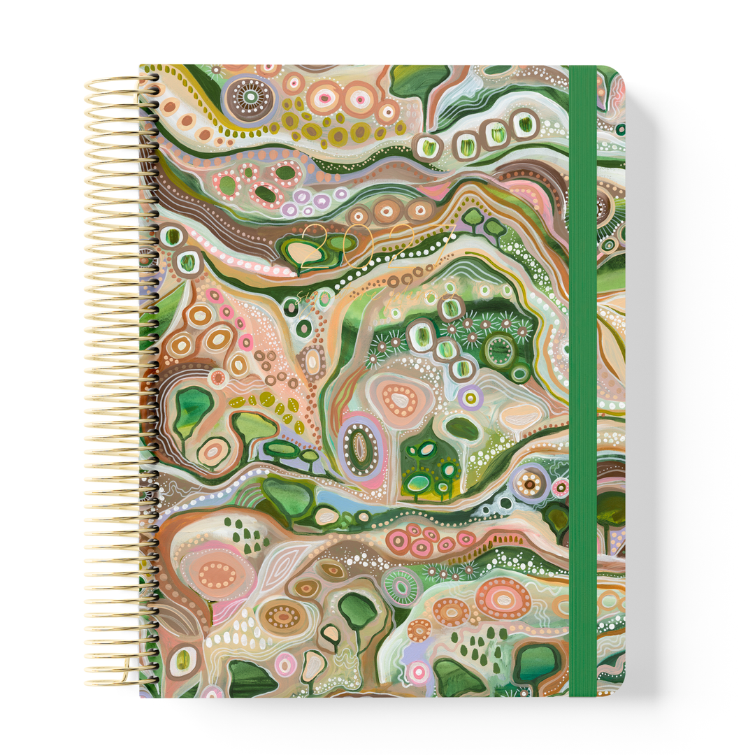 2027 Sacred Grandparent Tree Weekly Teacher Planner with detailed earthy artwork, gold coil and green elastic on white background.