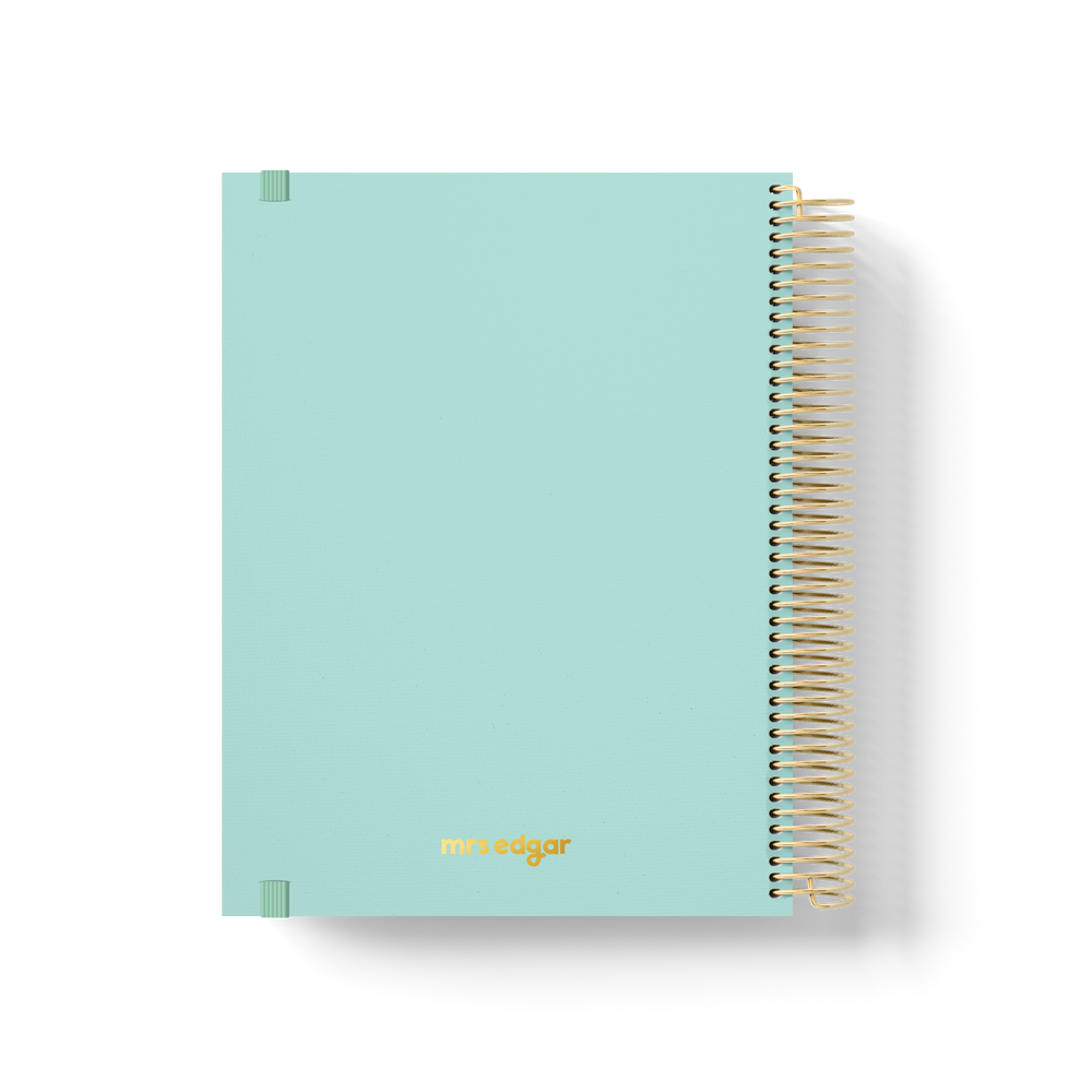 Mint green 2026 teacher planner back cover with gold foil “mrs edgar” logo and gold coil binding.
