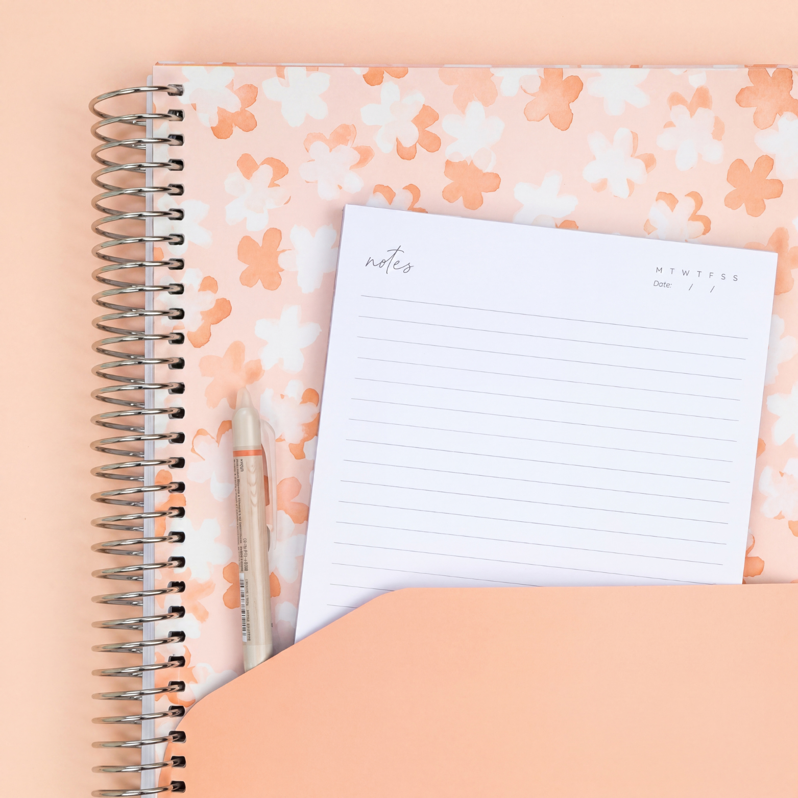 Teacher planner storage pocket with floral design, notes page and pen, ideal for organising lesson plans and documents.