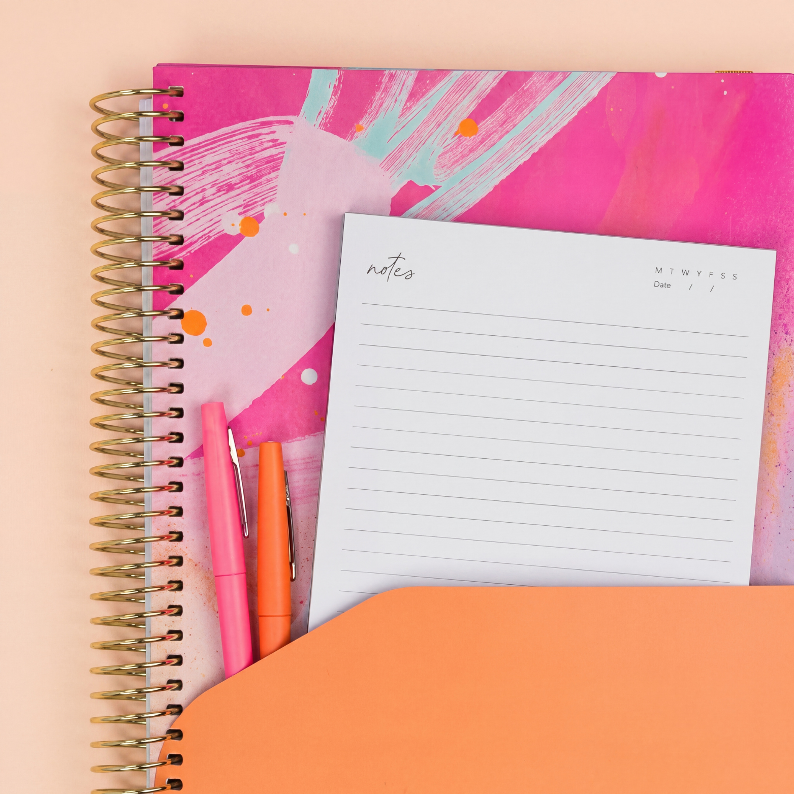 2027 Solar Glow Weekly Teacher Planner showing orange pocket sleeve with notes, pens and gold coil on a peach background.