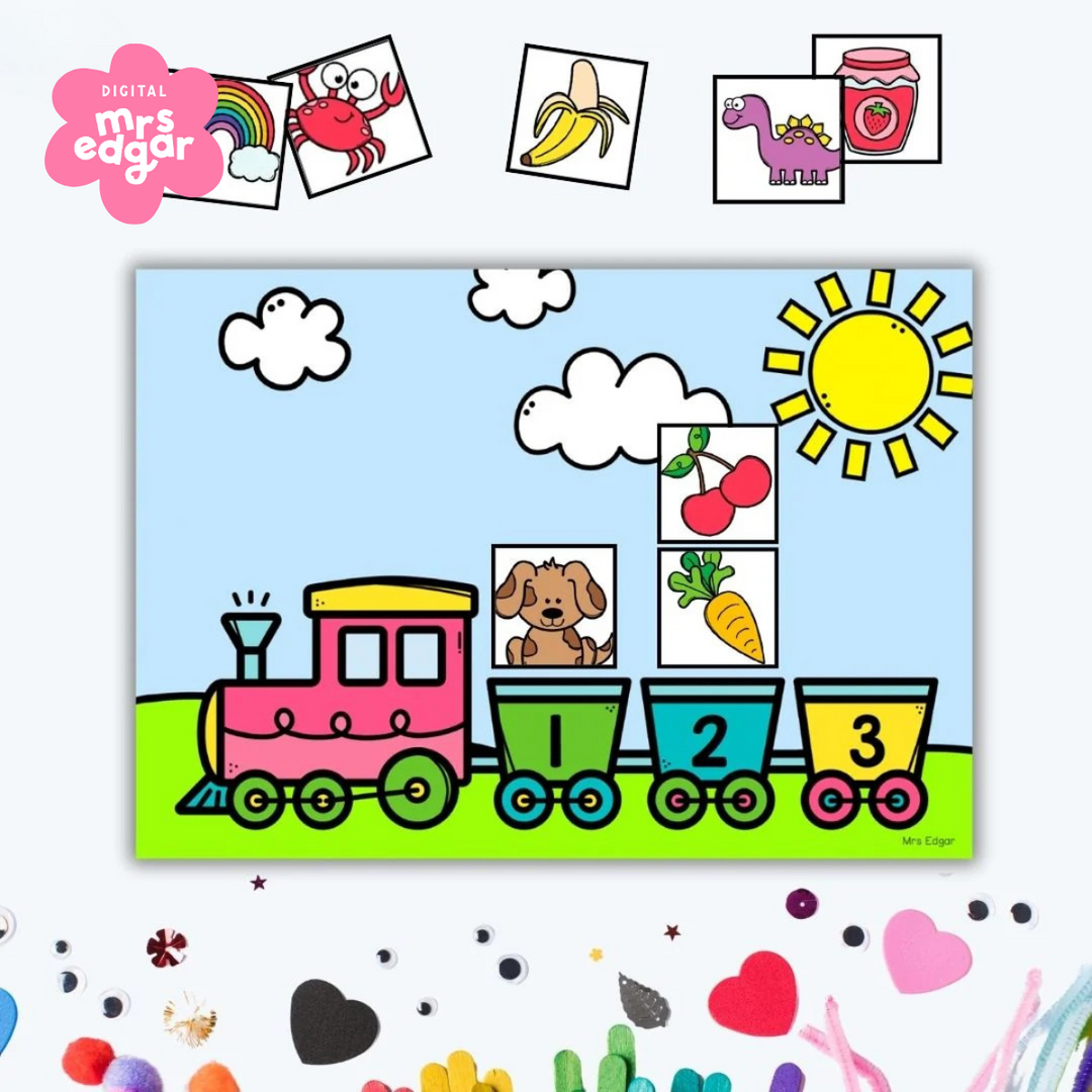 Brightly coloured train graphic with carriages numbered 1 to 4, set against a sunny background with clouds and a green field. Displayed amongst other decorative craft items.