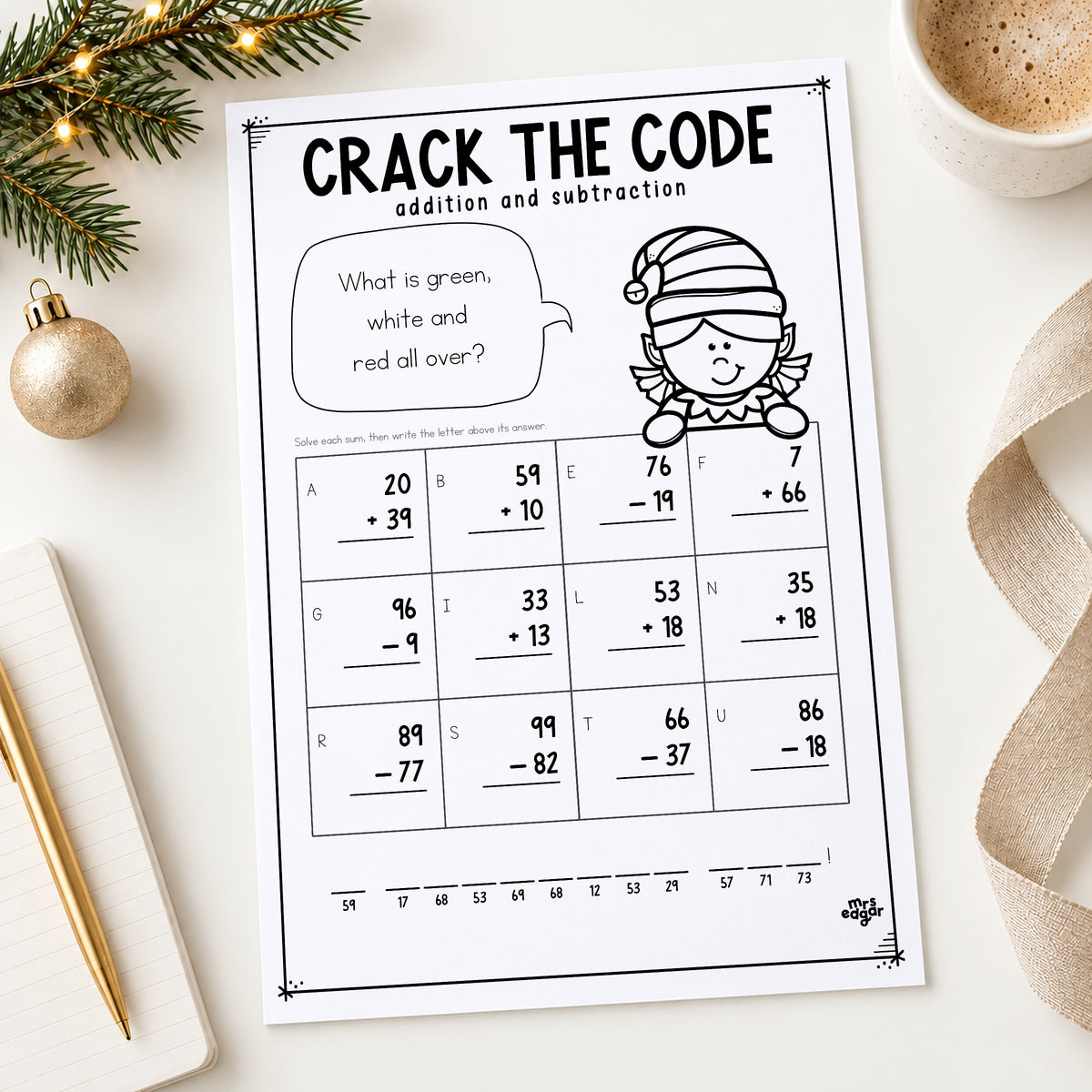 Christmas Crack the Code Year 3 worksheet printed and styled on a desk with pine, a gold bauble and a notebook.