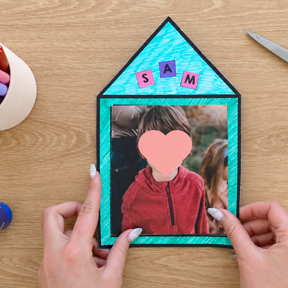 House-shaped All About Me craft with a student photo and the name SAM in letter tiles