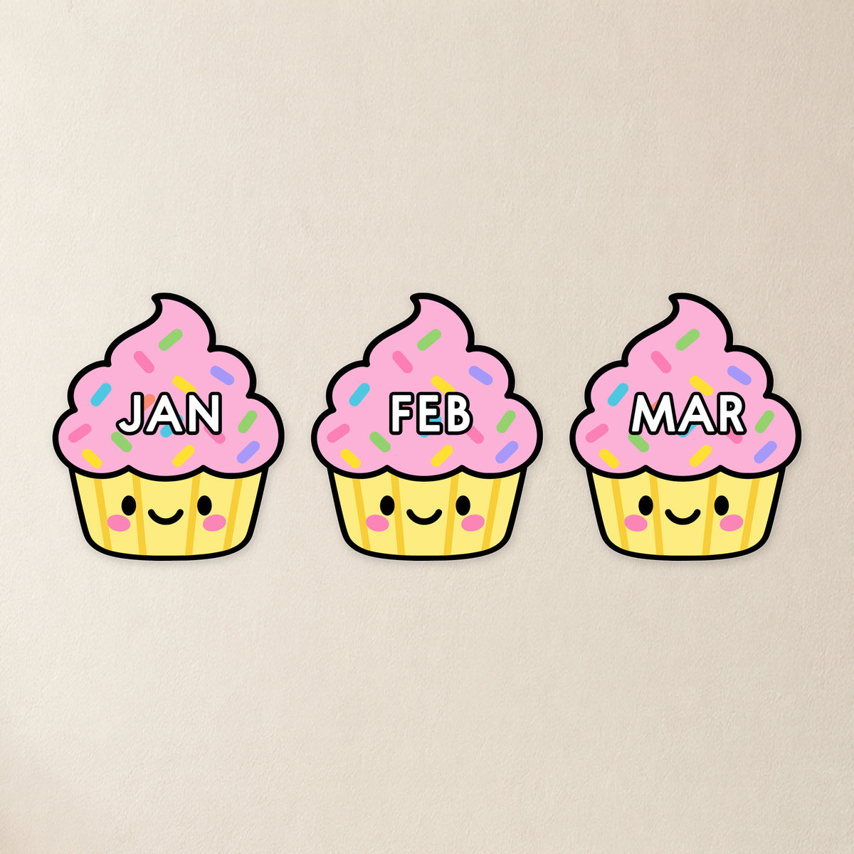 Three cut-out pink birthday cupcakes, Bright colours