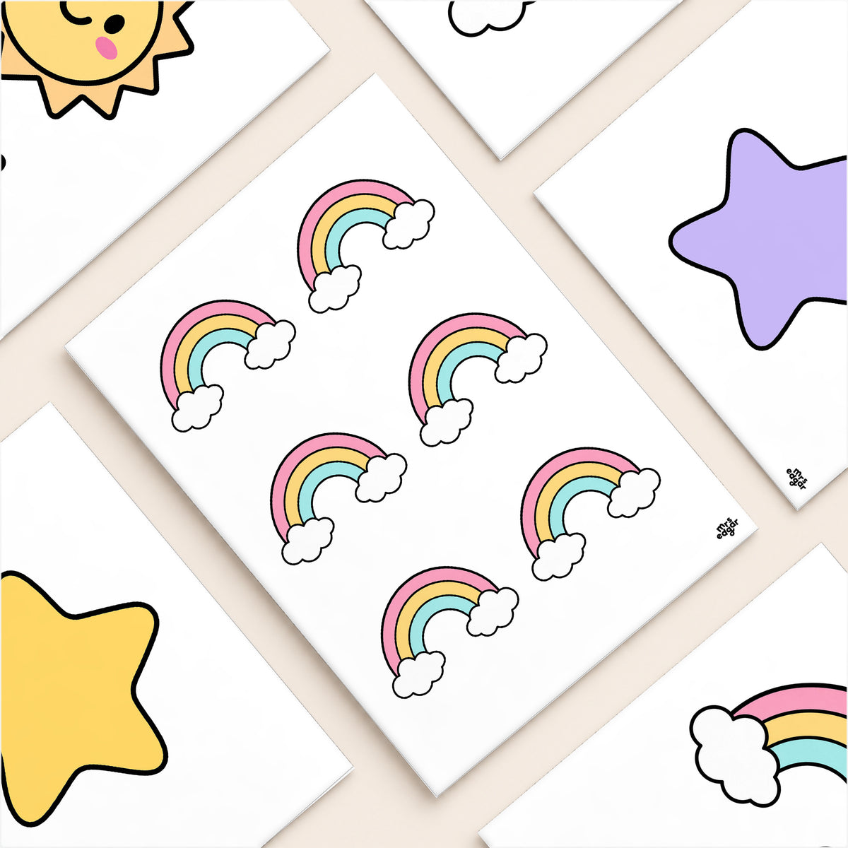 Flat lay of printed rainbow, star and sun garland pieces, Bright colours