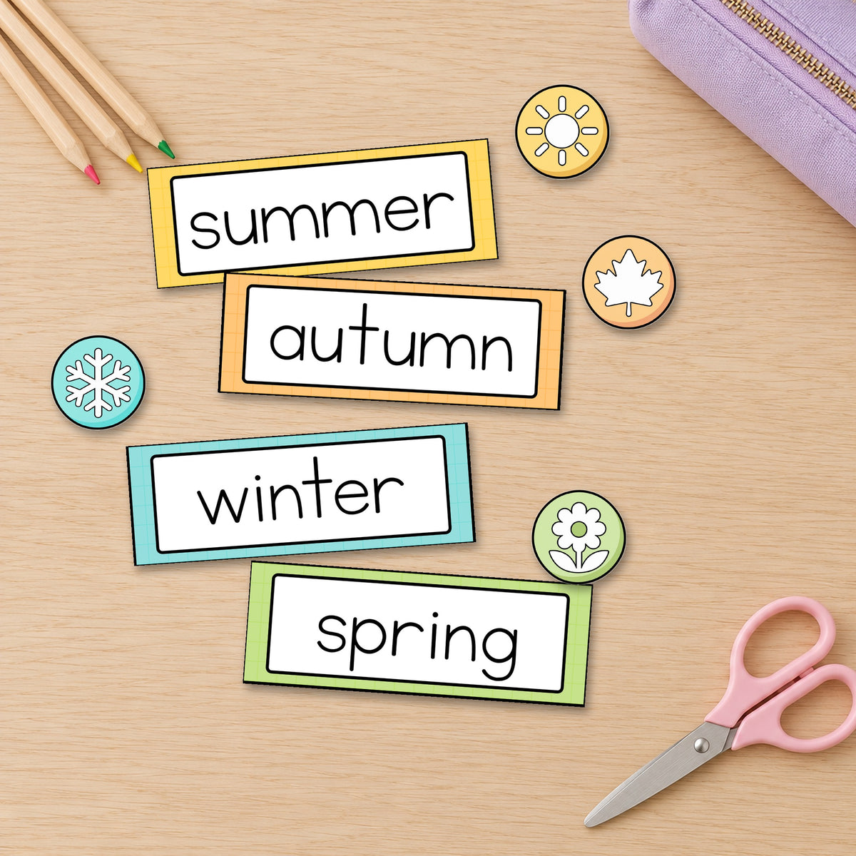 Flat lay of season cards and badges on a desk, Bright colours