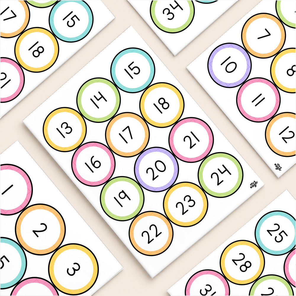 Flat lay of white-centre number circle labels, Bright colours