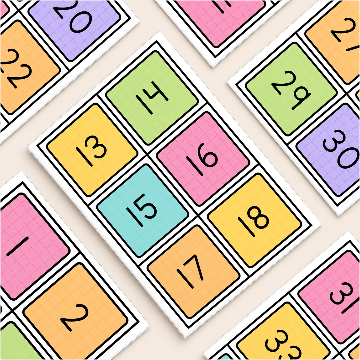 Flat lay of number square labels with a black line, Bright colours