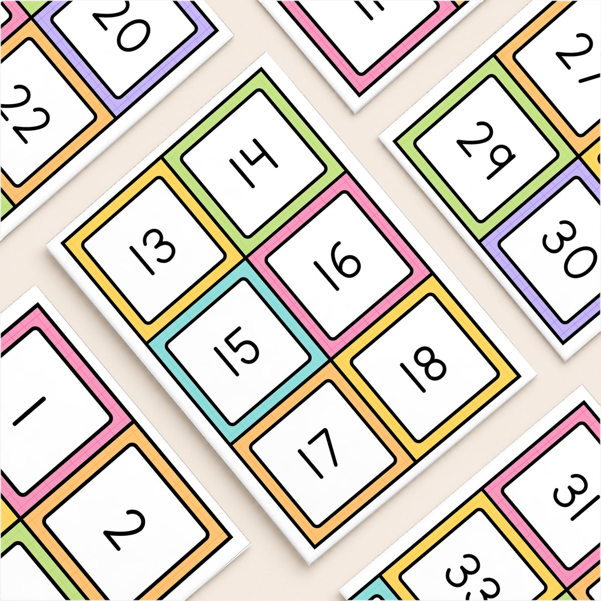 Flat lay of white-centre number square labels, Bright colours