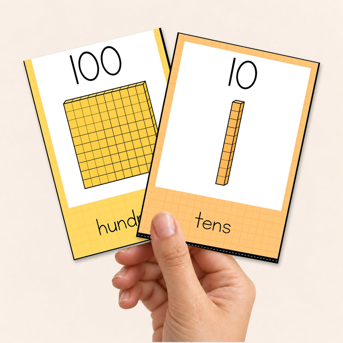 Hand holding 4-up place value cards, Bright colours