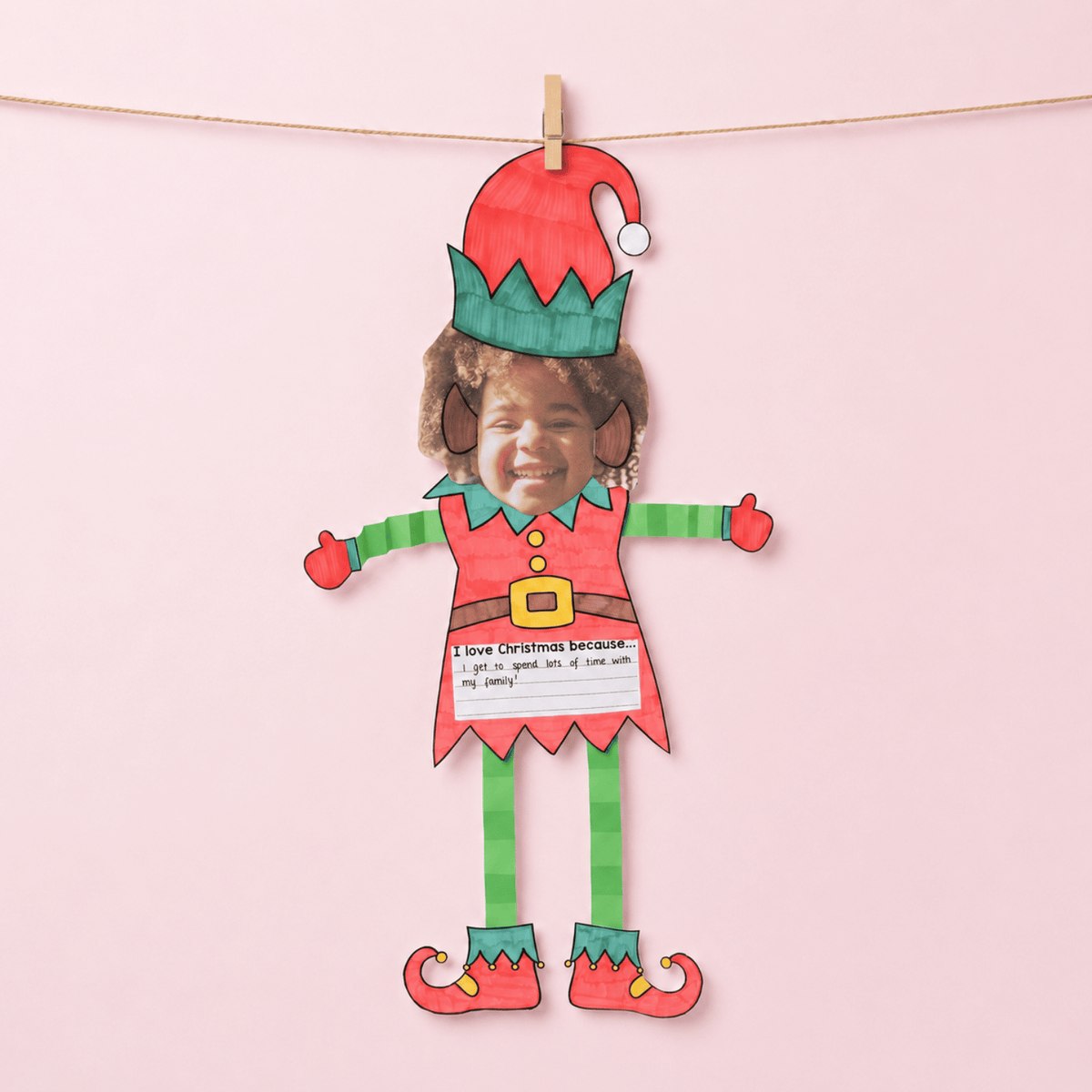 Christmas Elf craft template with photo space at top, "I love Christmas because..." prompt, and decorative elf illustration with text box at bottom.
