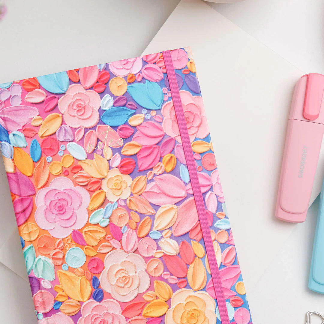 Teacher notebook with colourful floral cover and highlighter, perfect teacher stationery for planning, notes and classroom organisation
