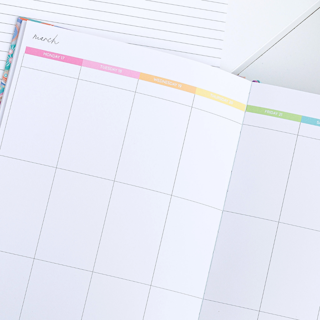 Close-up of the top of the open general planner, showing the March calendar with weekdays in rainbow colours.