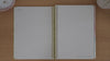 Neutrals teacher planner graph paper pages shown in a flip-through