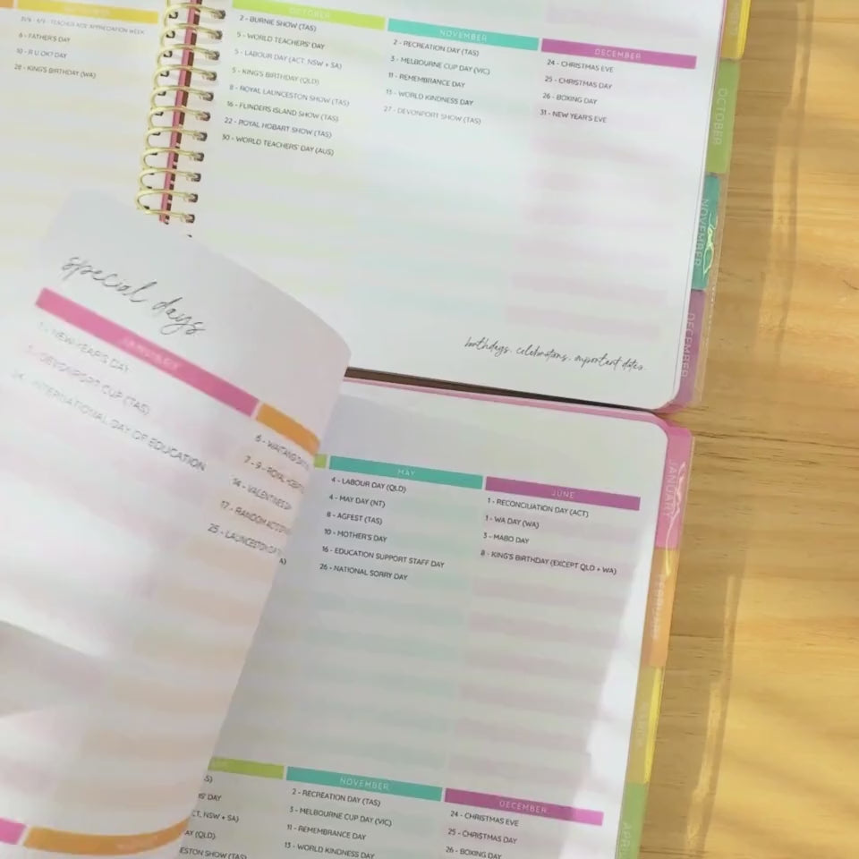 Hands flipping through a 2026 teacher planner, highlighting the monthly layout, daily spreads, and colourful tabbed sections.