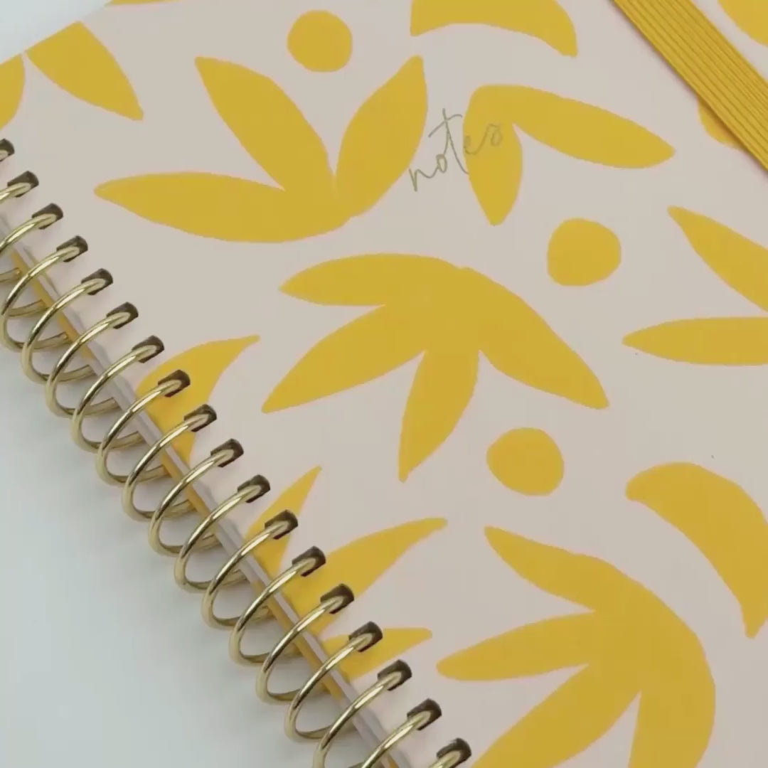 Sunburst Golden notebook design shown in video form, inside and outside of notebook 