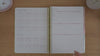 Neutrals teacher planner introduction pages shown in a flip-through