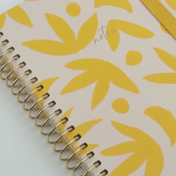 Sunburst Golden notebook design shown in video form, inside and outside of notebook 