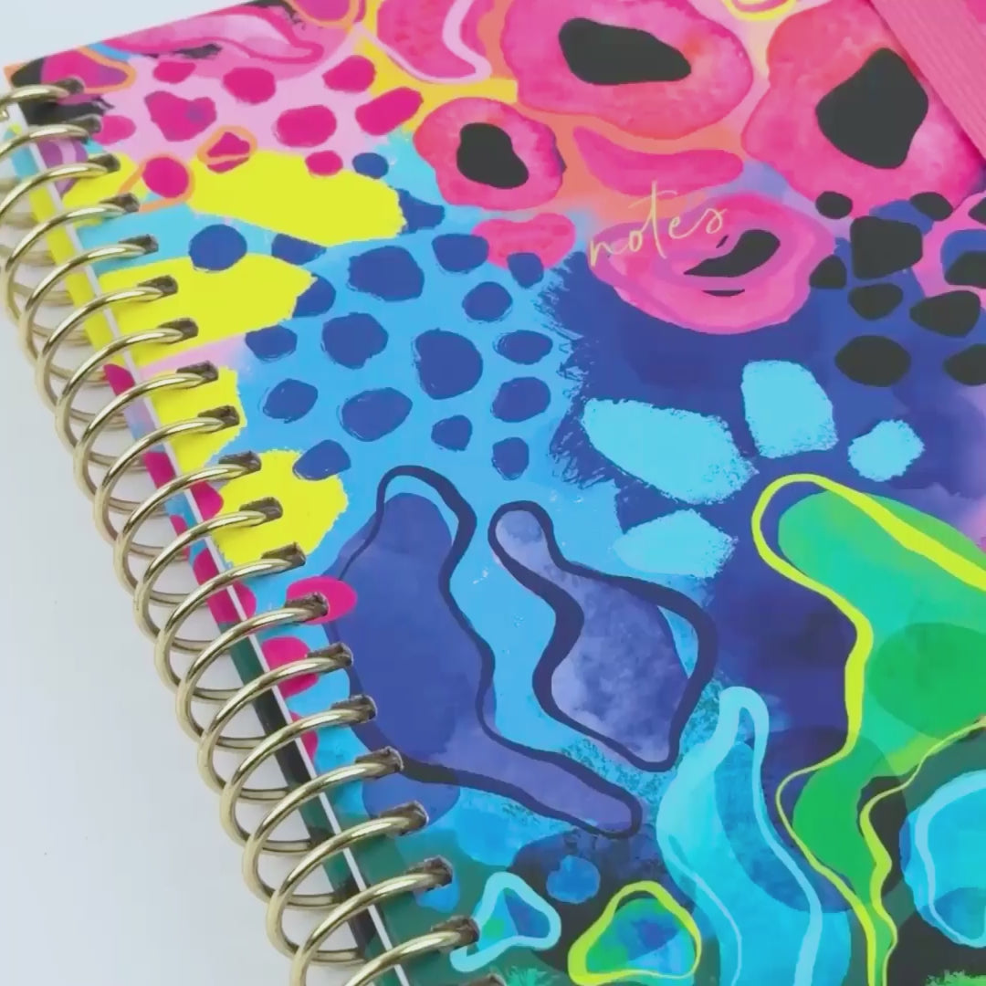 video showing notebook 'Boom' with bright colours and fun designs