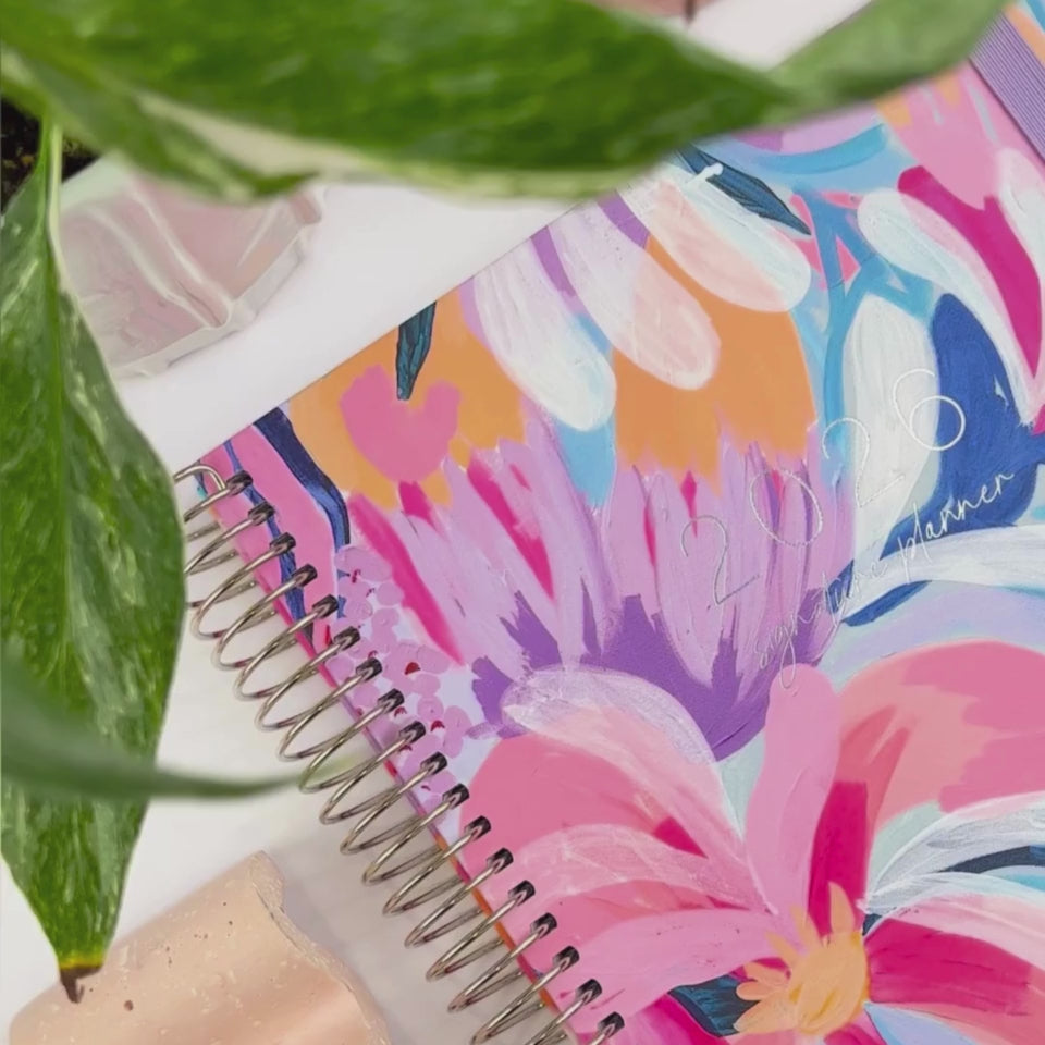 The 2026 Ruben weekly teacher planner cover being showcased on a white desk.