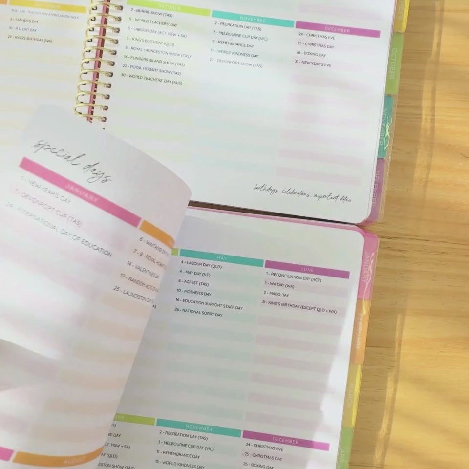 Hands flipping through a 2026 teacher planner, highlighting the monthly layout, daily spreads, and colourful tabbed sections.