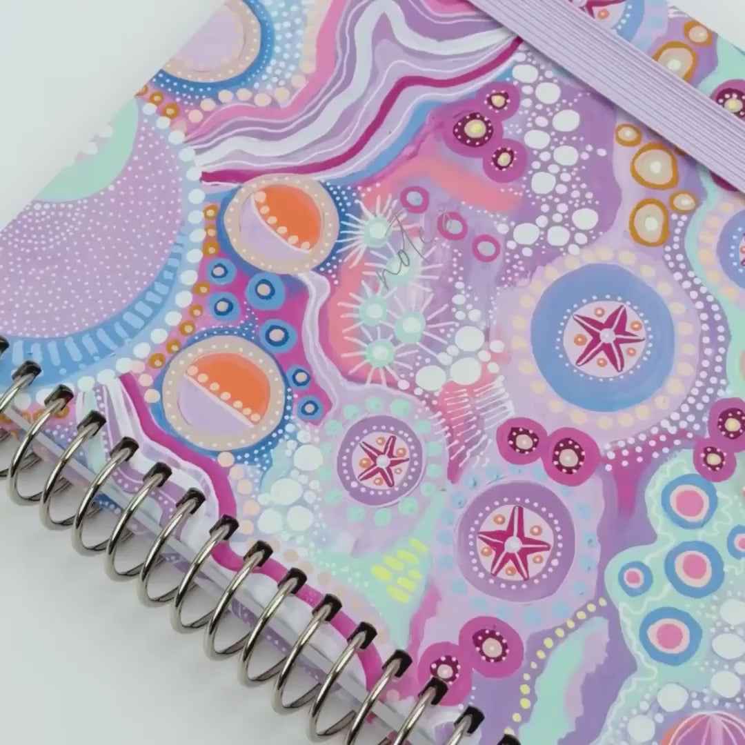 video showcasing the walking with the stars design on a notebook