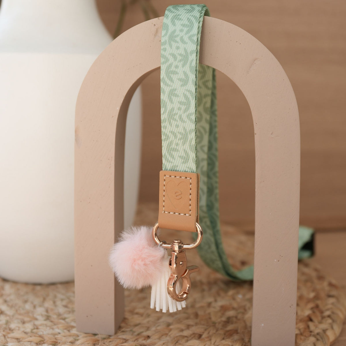 Sunburst Sage teacher lanyard by Cass Deller full length, gold clasp, peach pom pom and white tassel