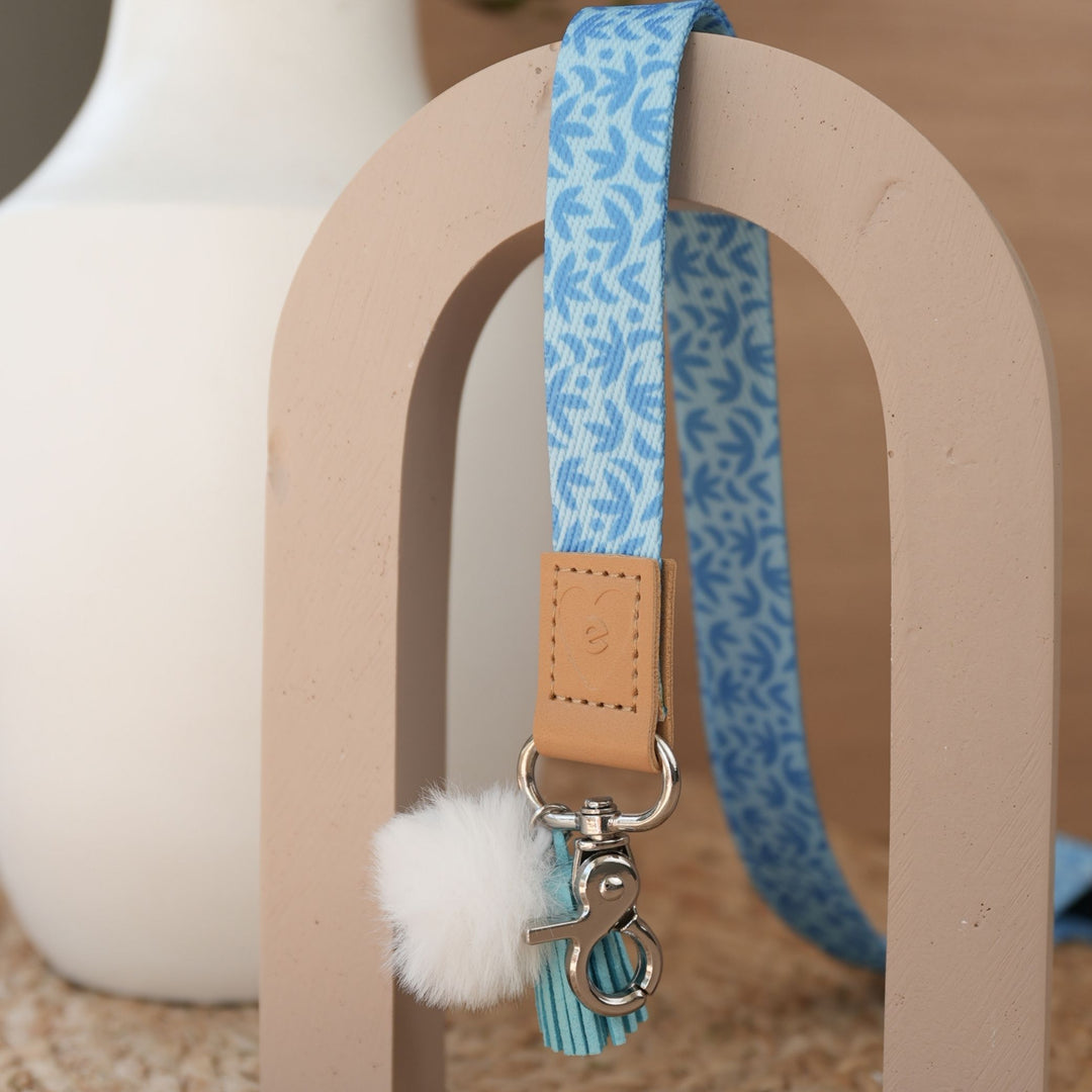 Sunburst Sky Blue teacher lanyard by Cass Deller full length, silver clasp, white pom pom and sky blue tassel