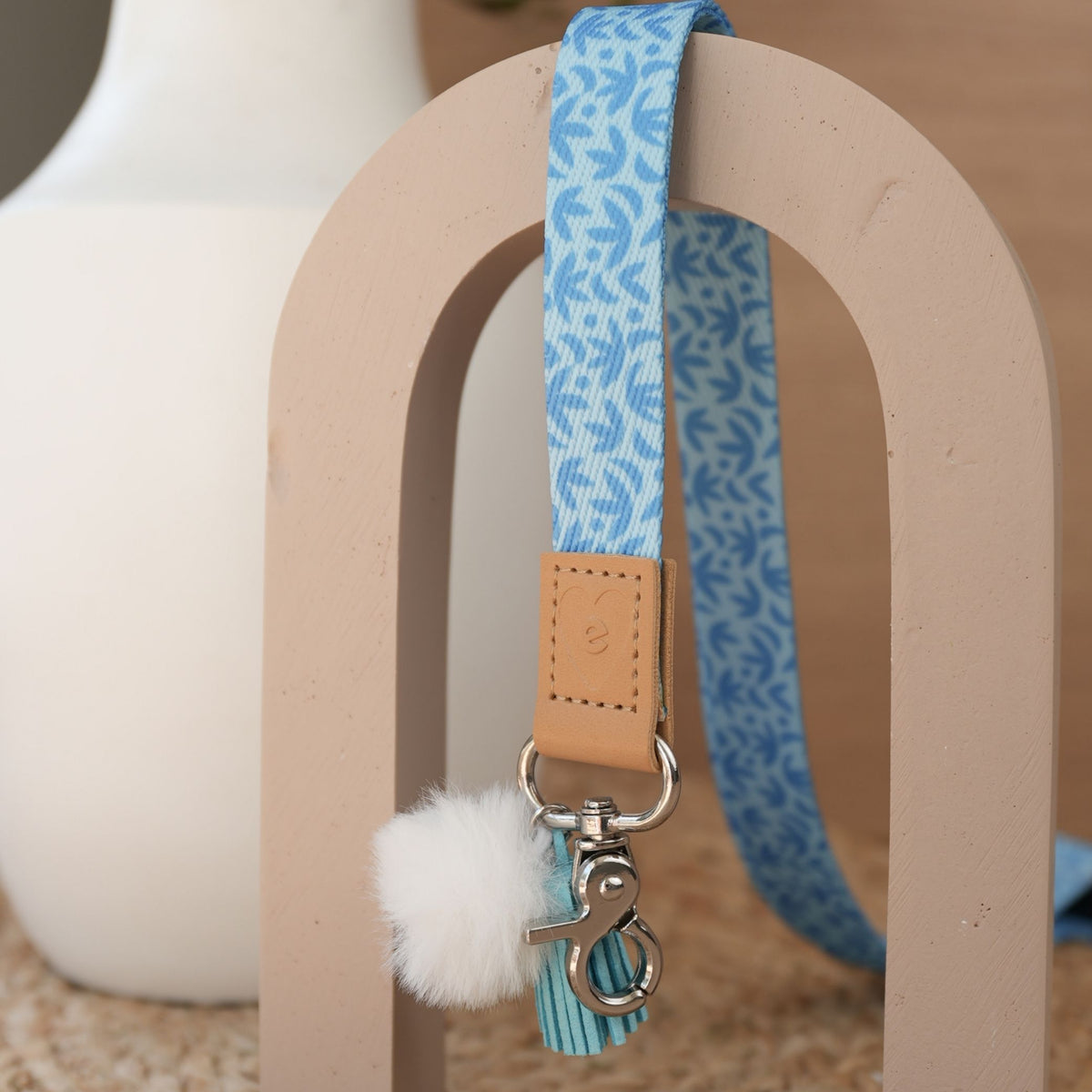 Sunburst Sky Blue teacher lanyard by Cass Deller full length, silver clasp, white pom pom and sky blue tassel