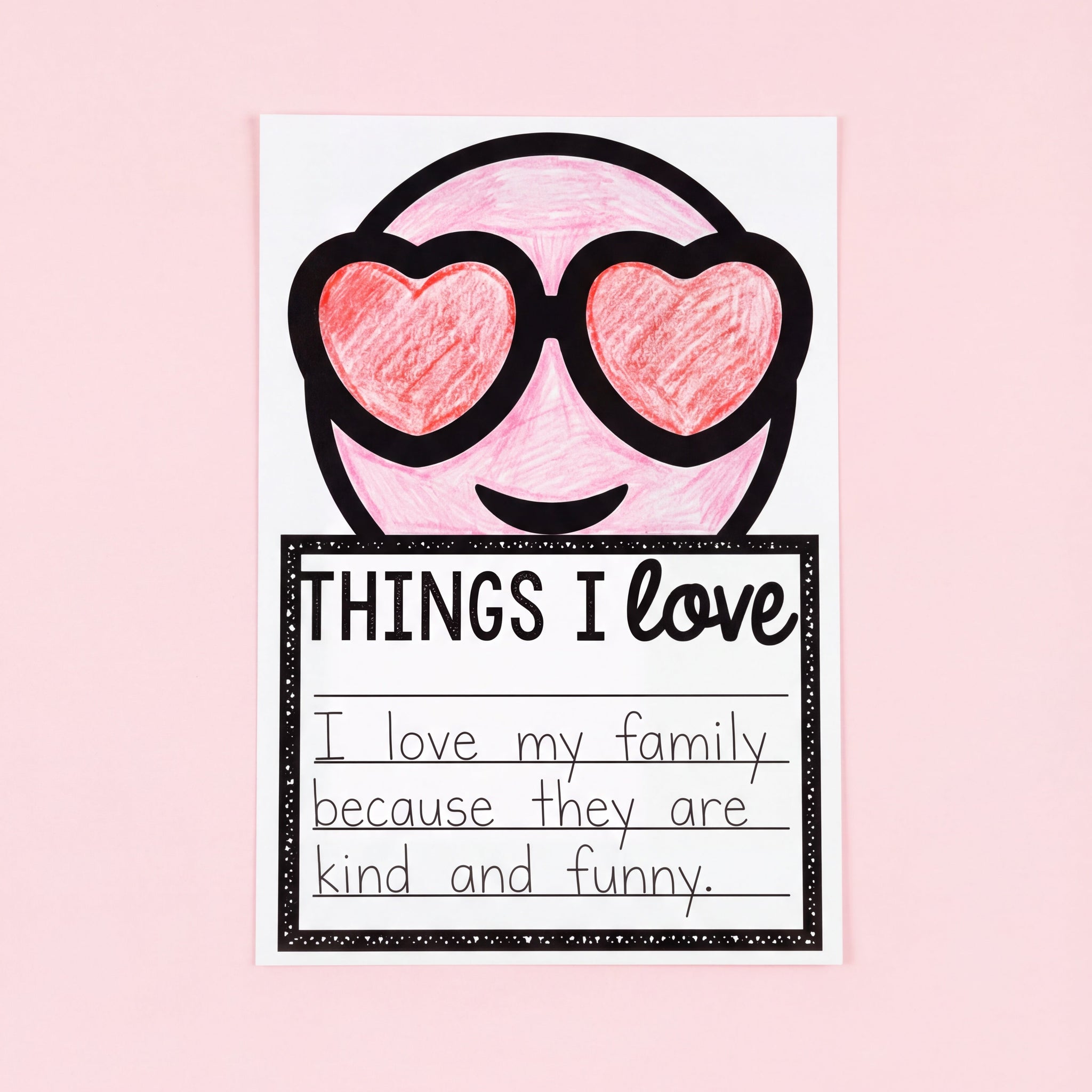 Black-and-white printable worksheet featuring a smiling emoji with heart-shaped sunglasses. Below is a lined writing section titled 'Things I Love' for students to list their favourite things.