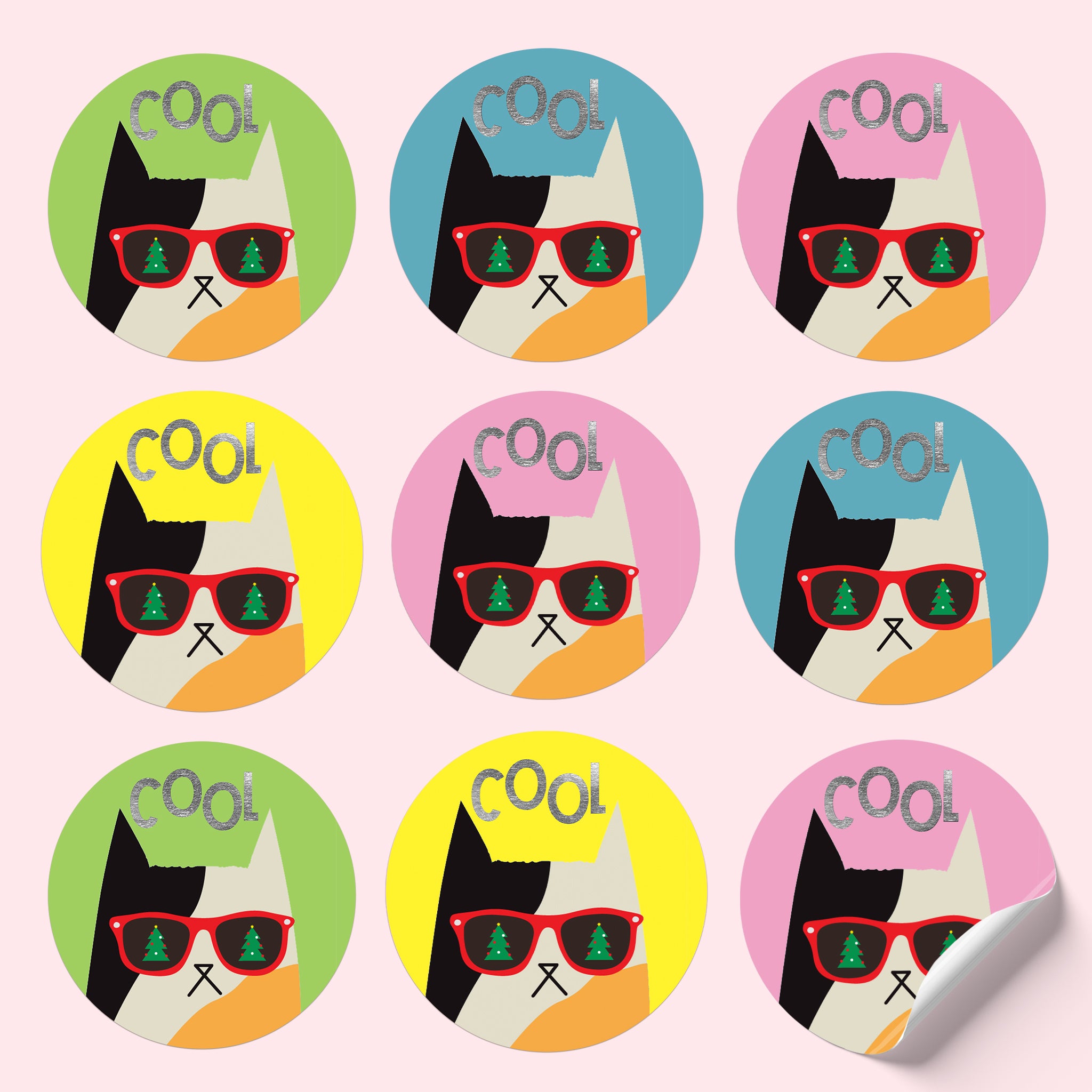 Sticker sheet featuring a calico cat in Christmas sunglasses on colourful backgrounds, with silver foiled text reading 'Cool.'